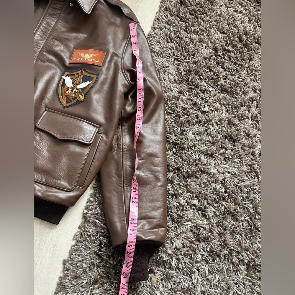Vintage-Inspired Brown Leather Bomber Jacket with Patch Accents - Picture 6 of 10
